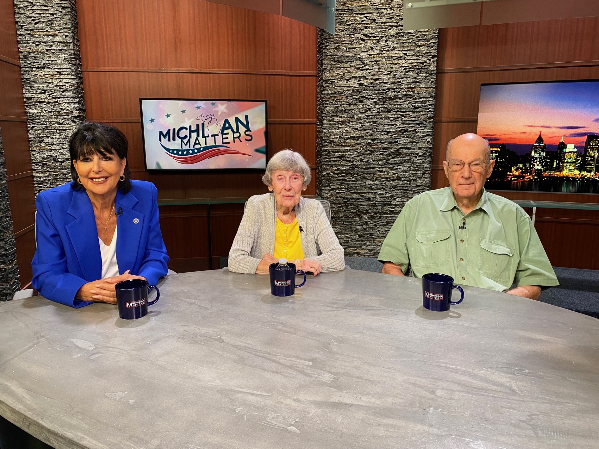 Philomena Mantella sits with Bob and Ellen Thompson